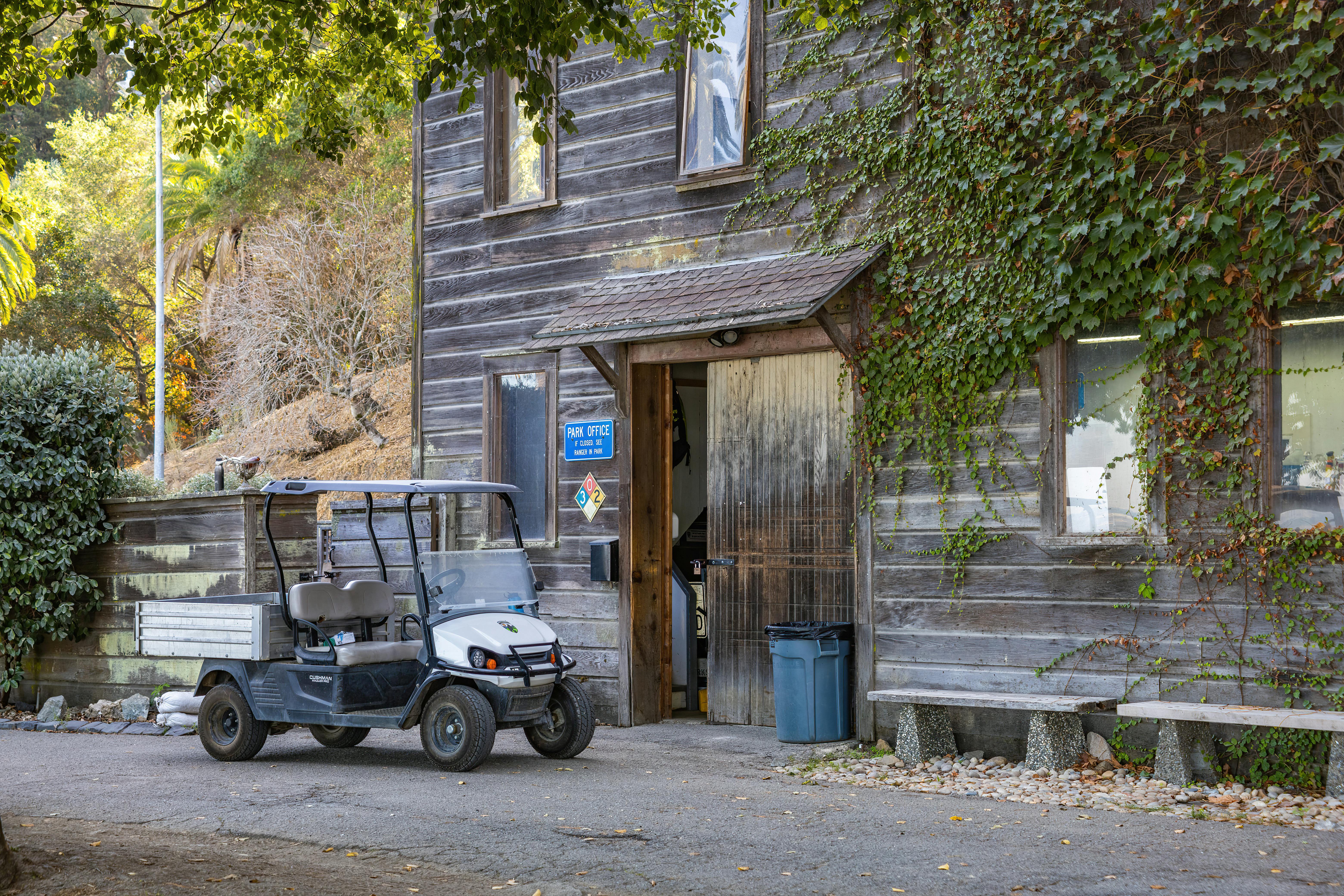 Mirror Facing Window With Trash Cans And Sharp Rooflines