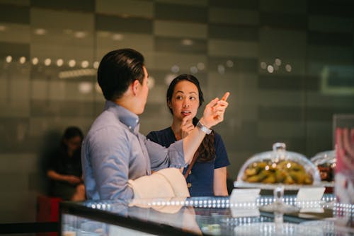 Free Man Standing in Front of Woman Stock Photo