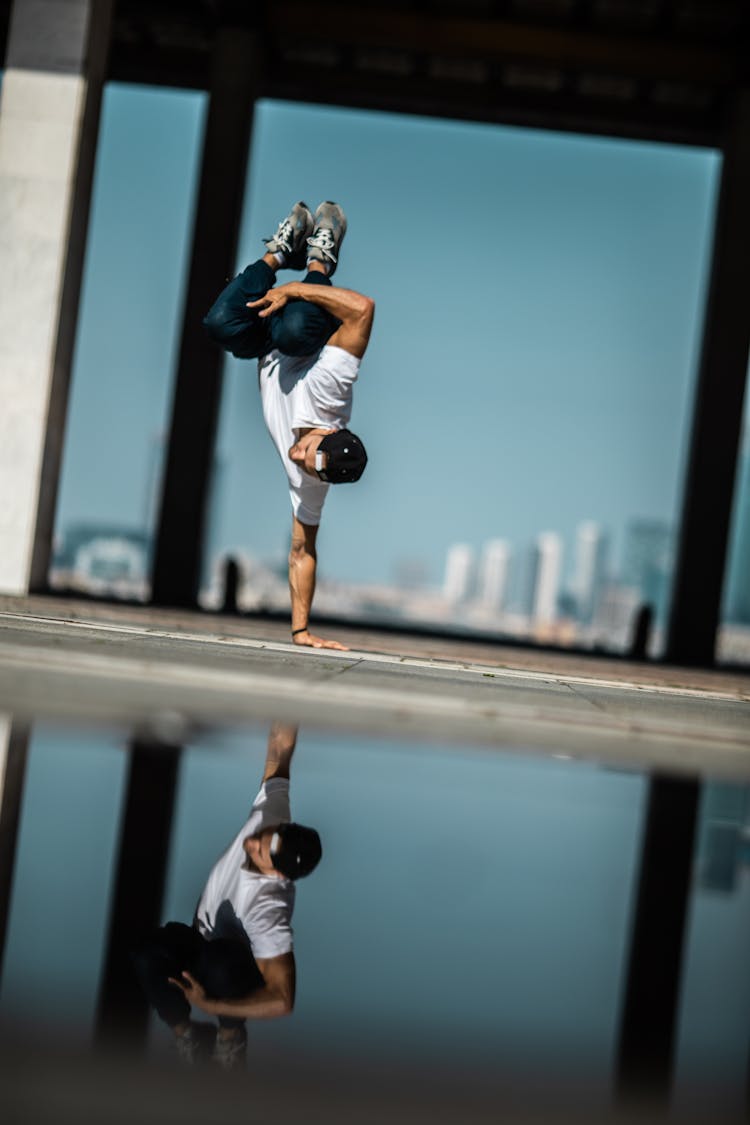 A Man Doing Handstand On The Street