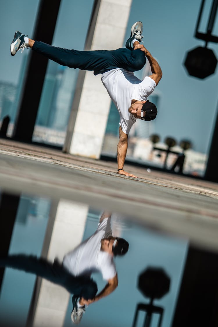 A Man Breakdancing On The Street