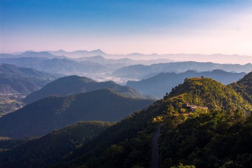 Free Stunning view of lush green mountains at sunrise, capturing natural beauty and serenity. Stock Photo