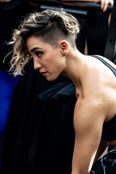 Captivating portrait of a stylish woman with short hair in an urban setting, exuding confidence and poise.