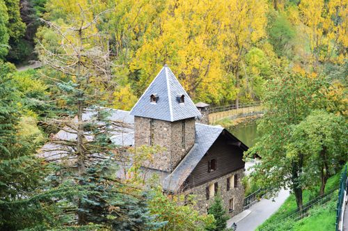 Free Charming stone house amidst lush green trees seen from above in Andorra la Vella. Stock Photo