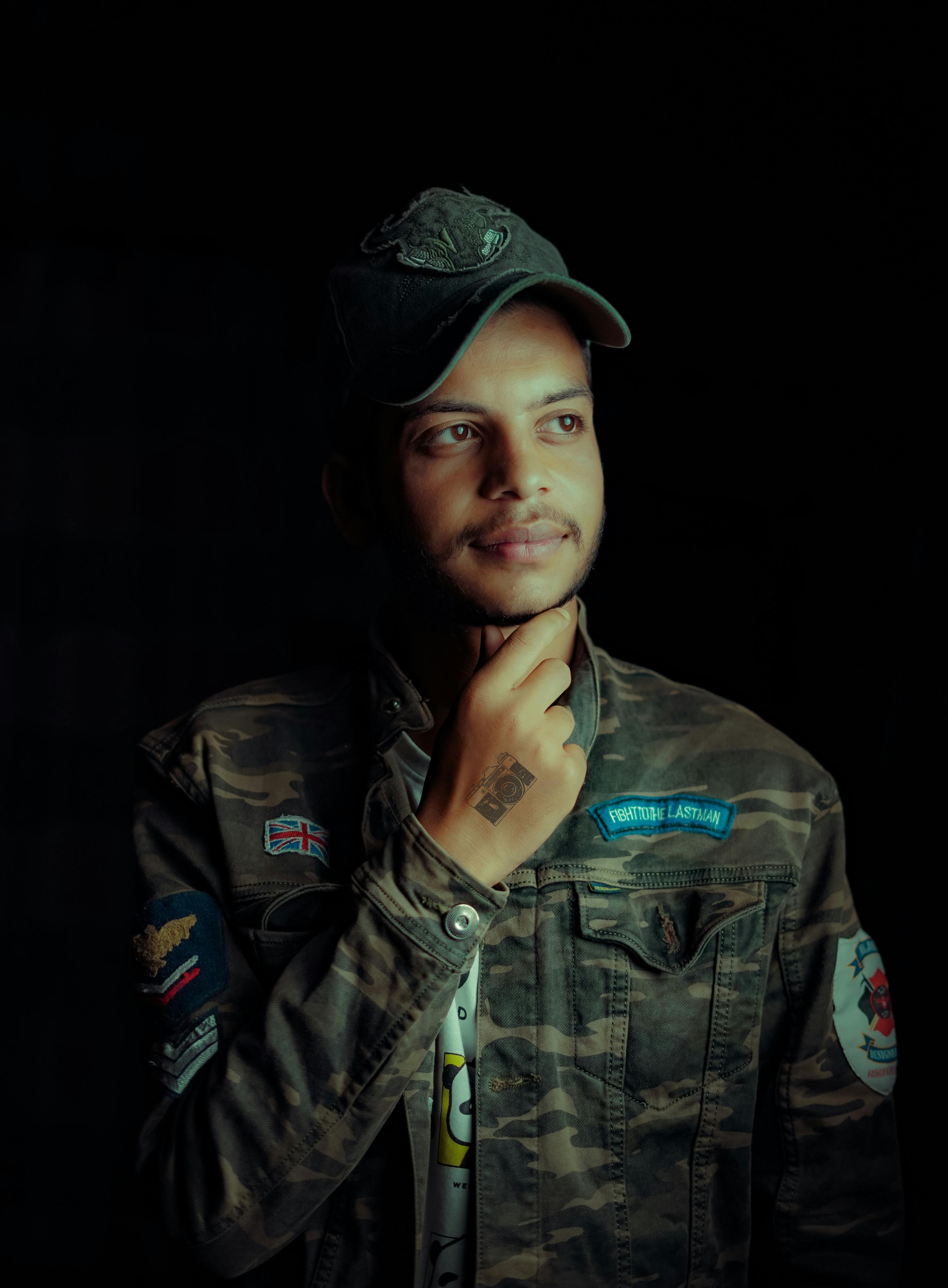 Man Wearing a Military Jacket and a Cap · Free Stock Photo