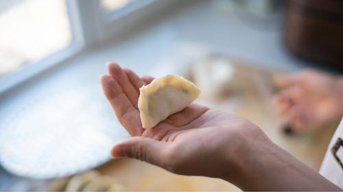 Dumpling on Palm of a Person
