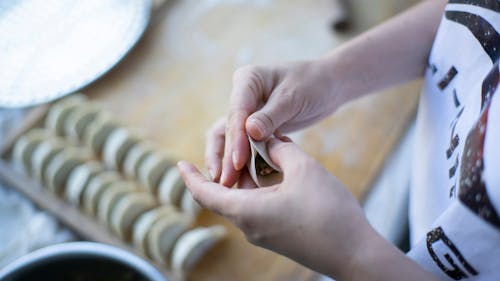 A Person Wrapping a Dumpling