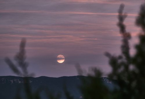 Free Serene view of the moon over the Tirana mountains at dusk, with a soft sky. Stock Photo