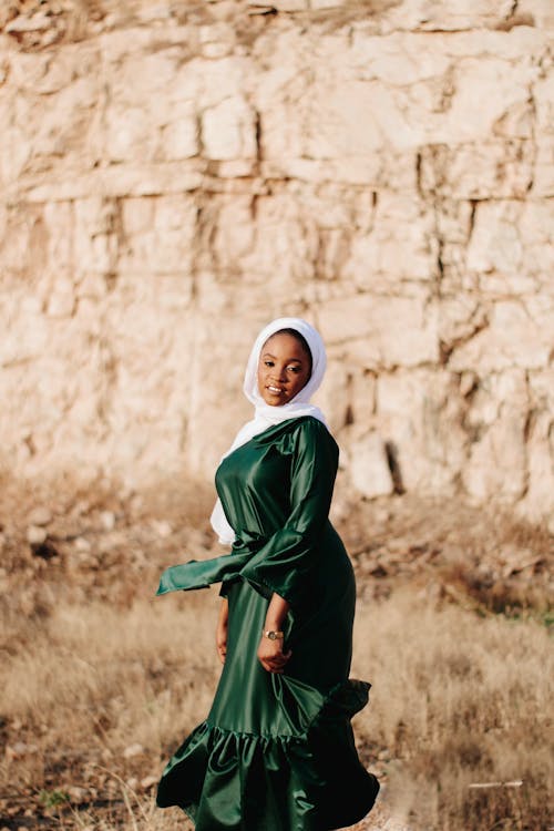 A Woman in Green Dress and White Hijab
