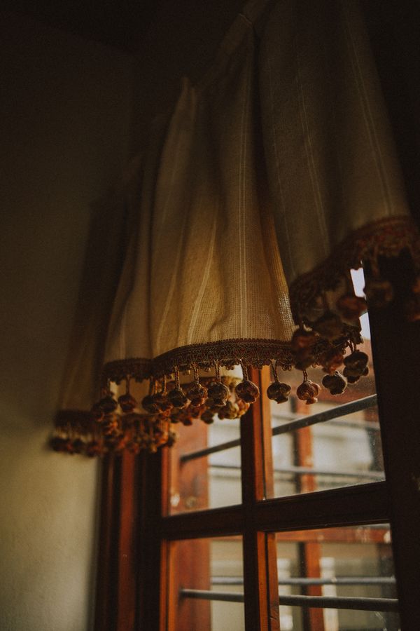 Warm sunlight filtering through curtains — photo by Emre Akyol on Pexels