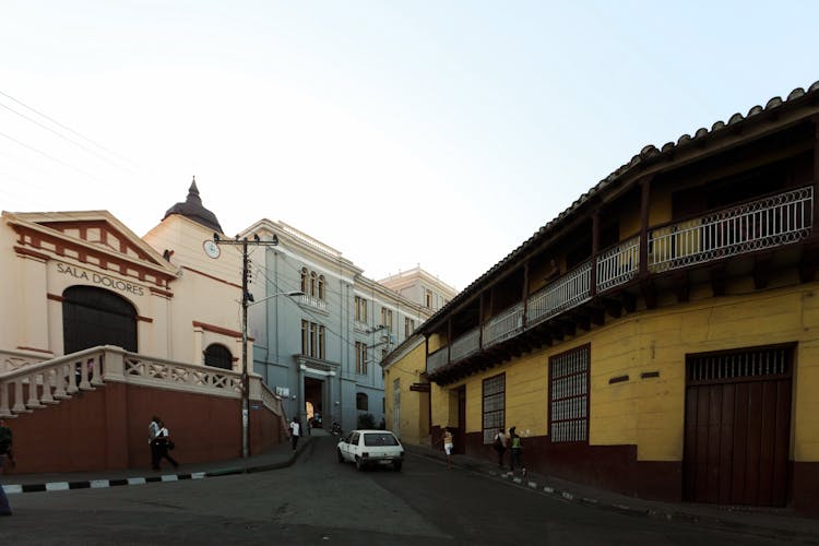 People Walking In Front Of Sala Dolores Church In Santiago Cuba 