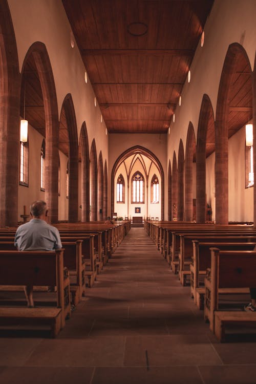 A Man Sitting on the Church