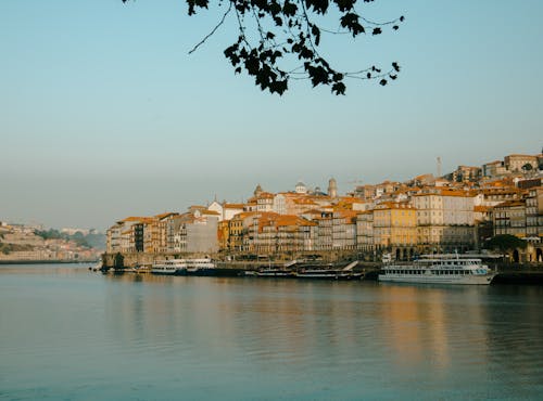 Waterfront Buildings and Boats Moored on the Riverbank in Porto, Portugal 