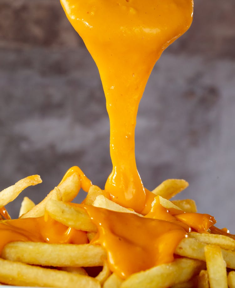 Melted Cheese Falling On French Fries 