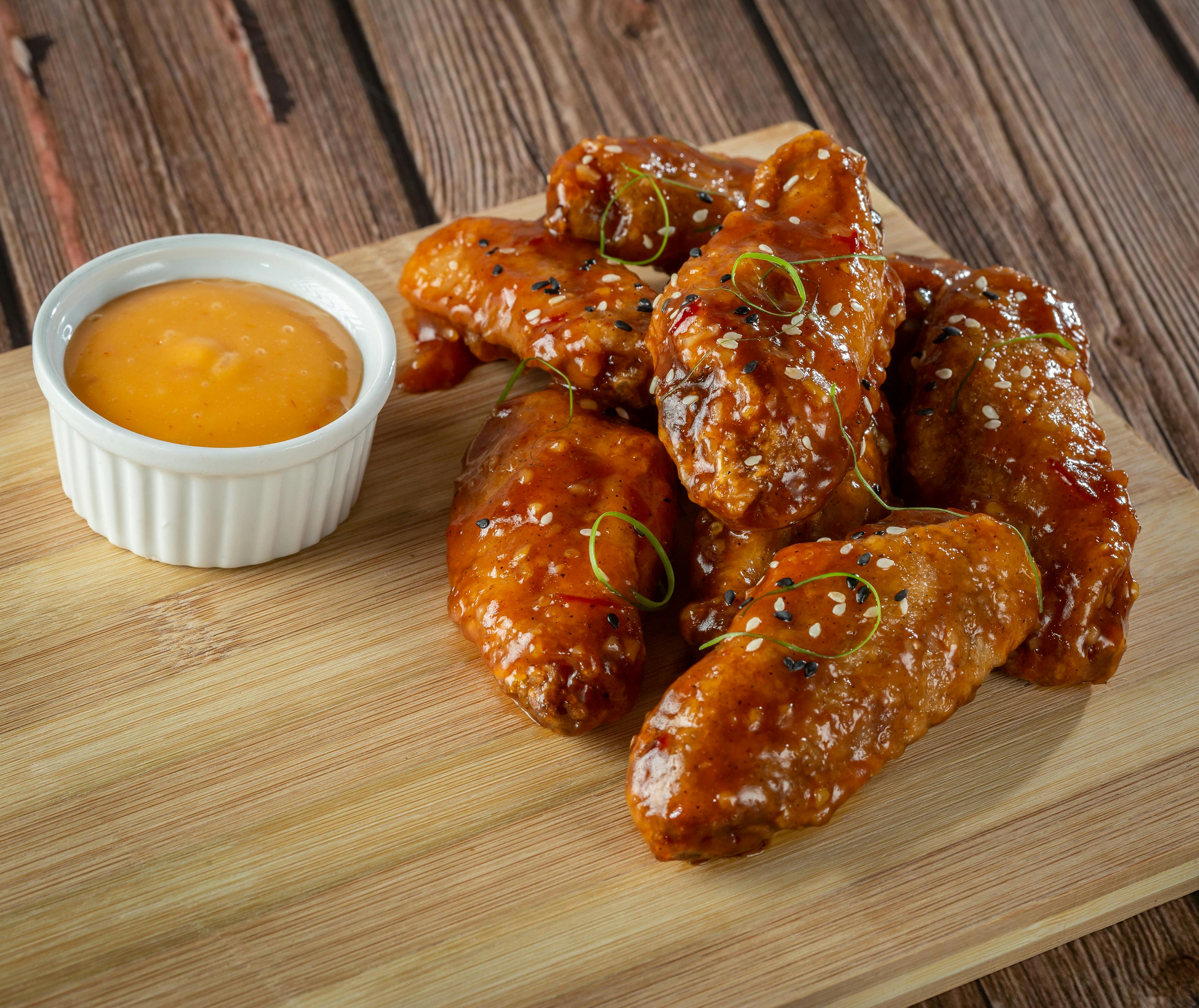 Chicken Wings on a Wooden Board · Free Stock Photo