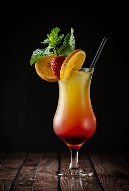 Alcoholic Cocktail with Fruits in Glass on Table