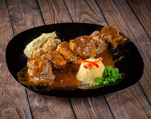 Close Up Photo of Cooked Dish on Black Round Plate