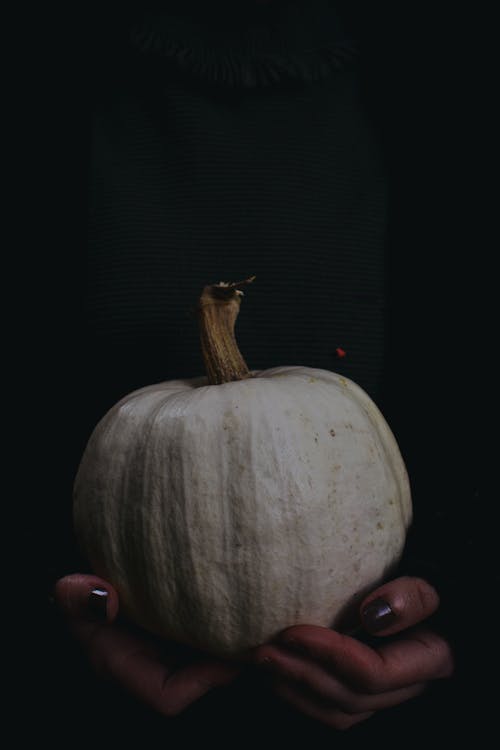 Woman Holding White Pumpkin 