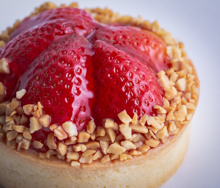 Close-Up Shot Of Strawberry Tart With Nuts 