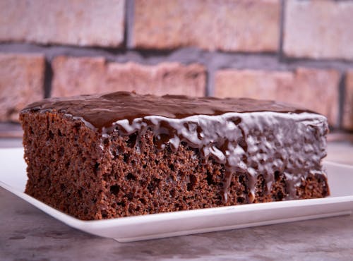Close-up of a Piece of Chocolate Cake with Glaze Icing 