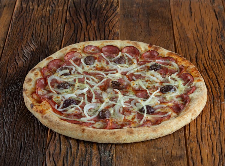 Pizza On Brown Wooden Table