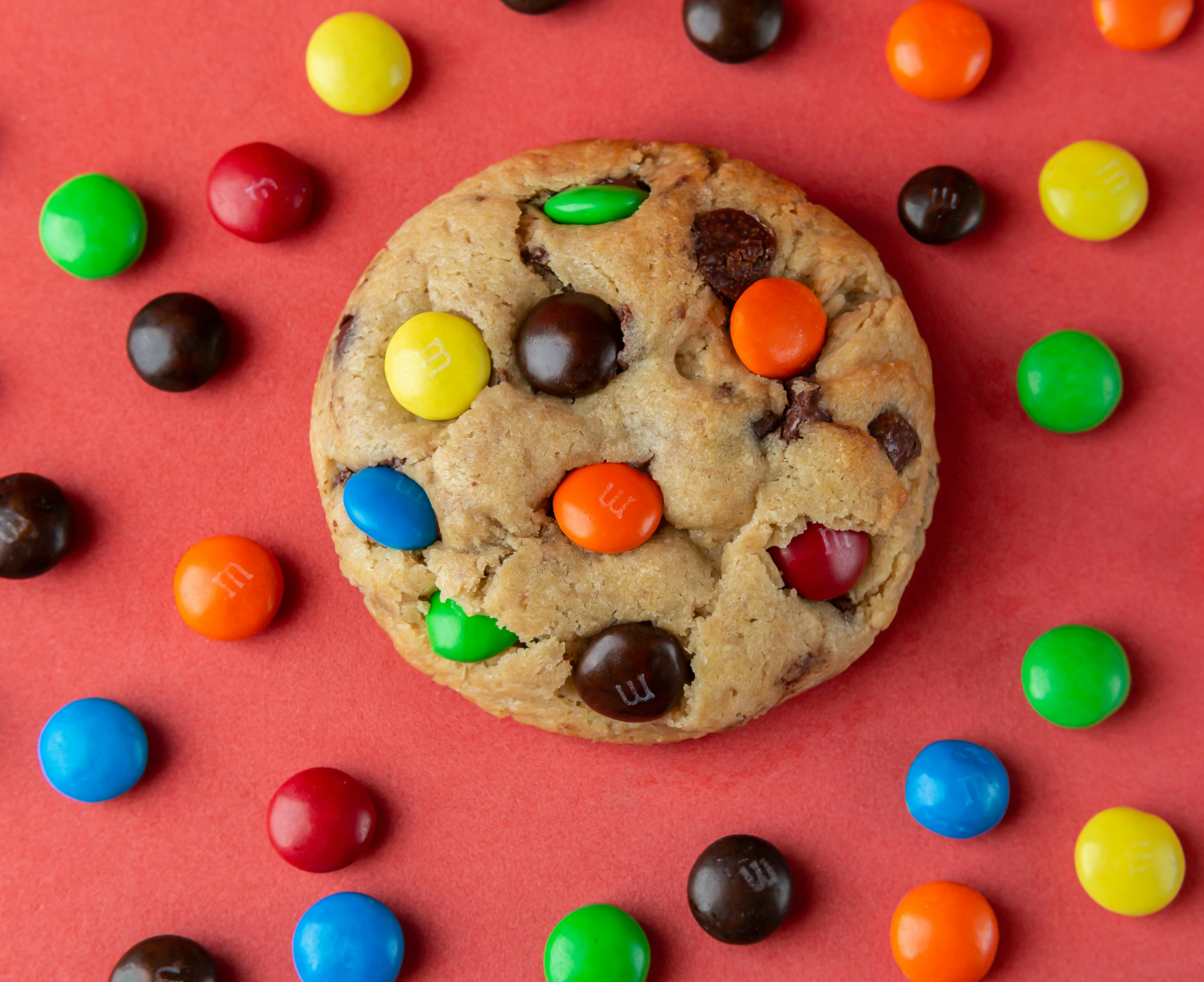 close up photo of chocolate m and m chips cookie