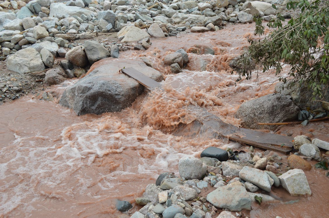 Steam Water Flowing between Rocks 