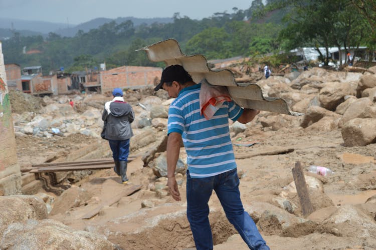 A Man Carrying A Roof 