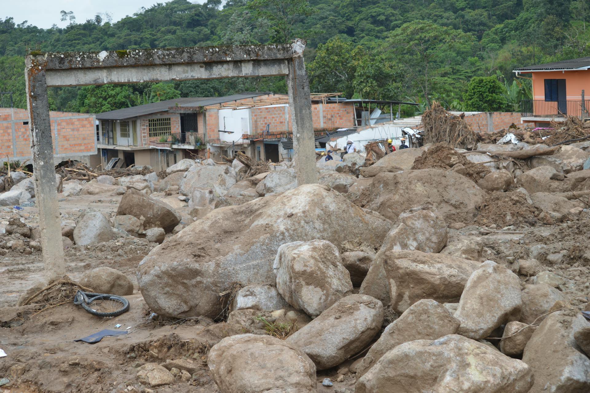 Concrete Lintel Among Stones and Mud Carried Away by an Avalanche