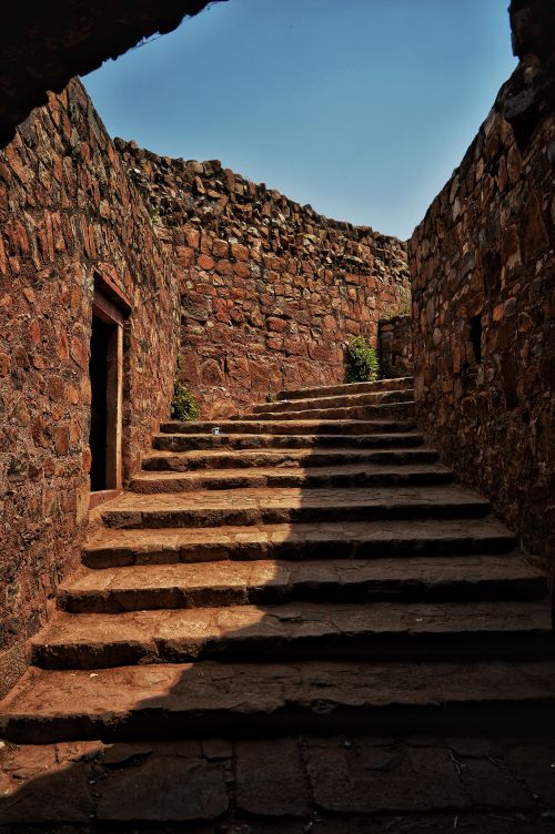 Free Explore the historic stone steps within a Delhi fort under a clear blue sky. Stock Photo