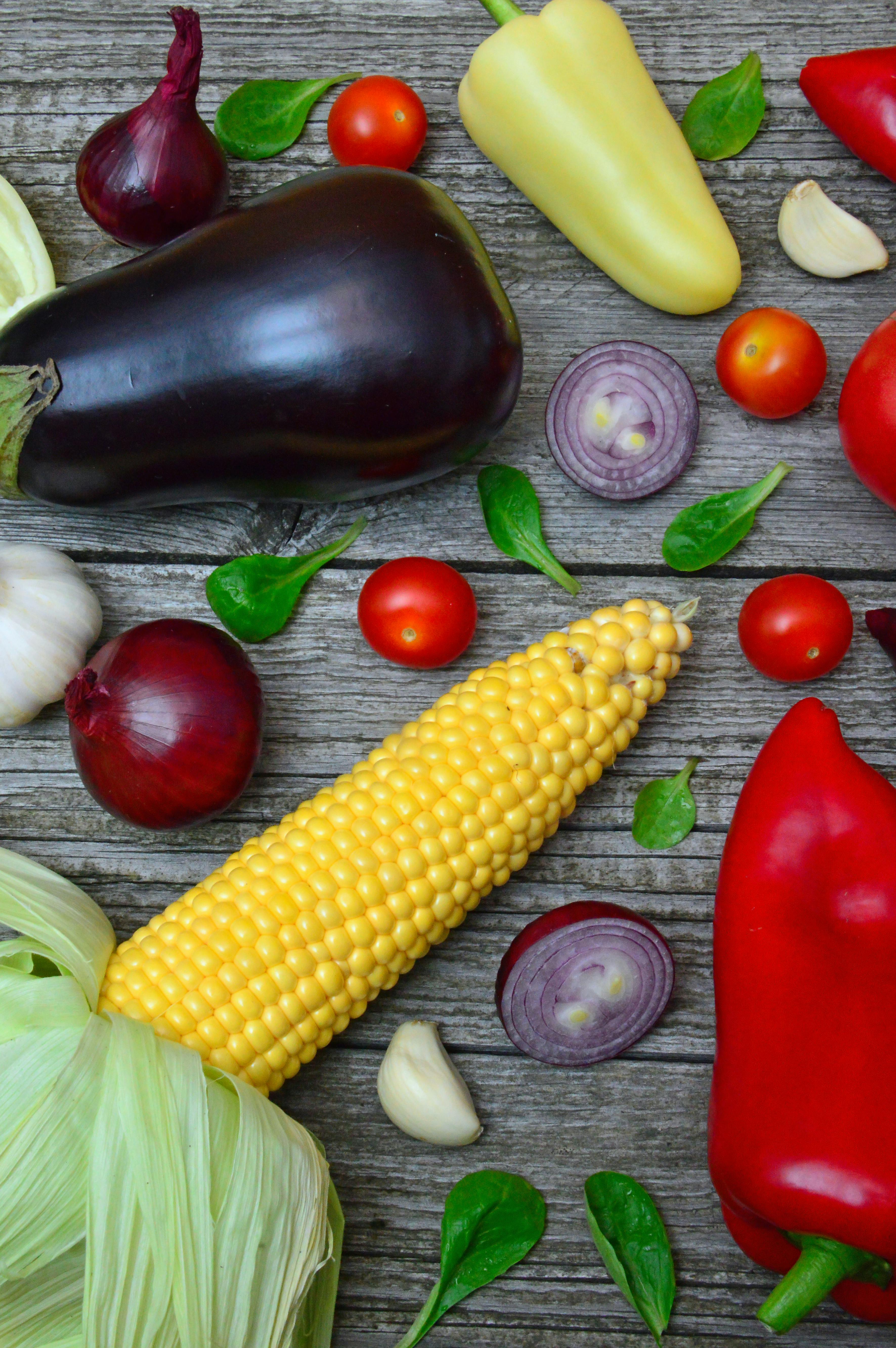 Assorted fruits, vegetables, nuts, and grains laid out on a table