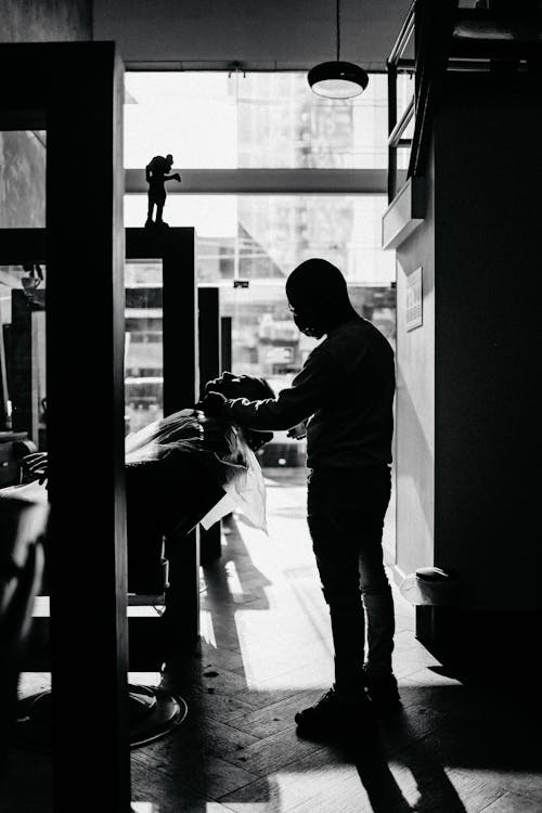 Black and White Photo of Two Men in a Barber Shop