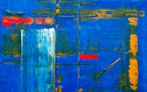 画布上的动态抽象绘画，以生动的蓝色、红色和黄色丙烯酸呈现