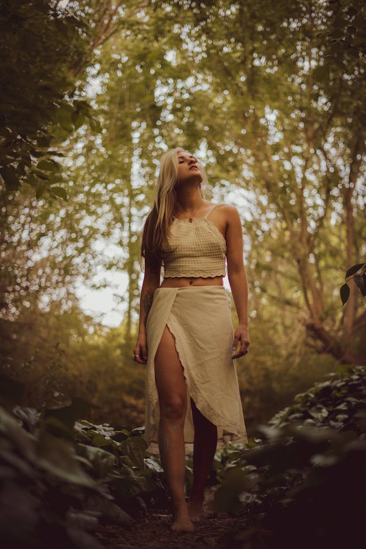 Barefoot Woman Walking In Forest