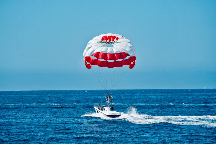 People Parasailing On The Beach