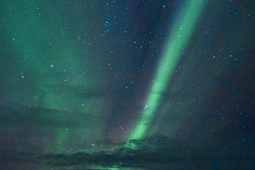 An Aurora Borealis at Night with Stars