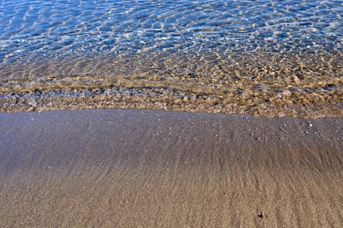 Foto profissional grátis de areia, claro, litoral