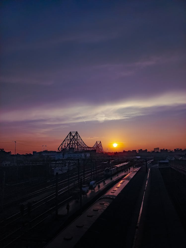 Train On Tracks On Railway Station At Night