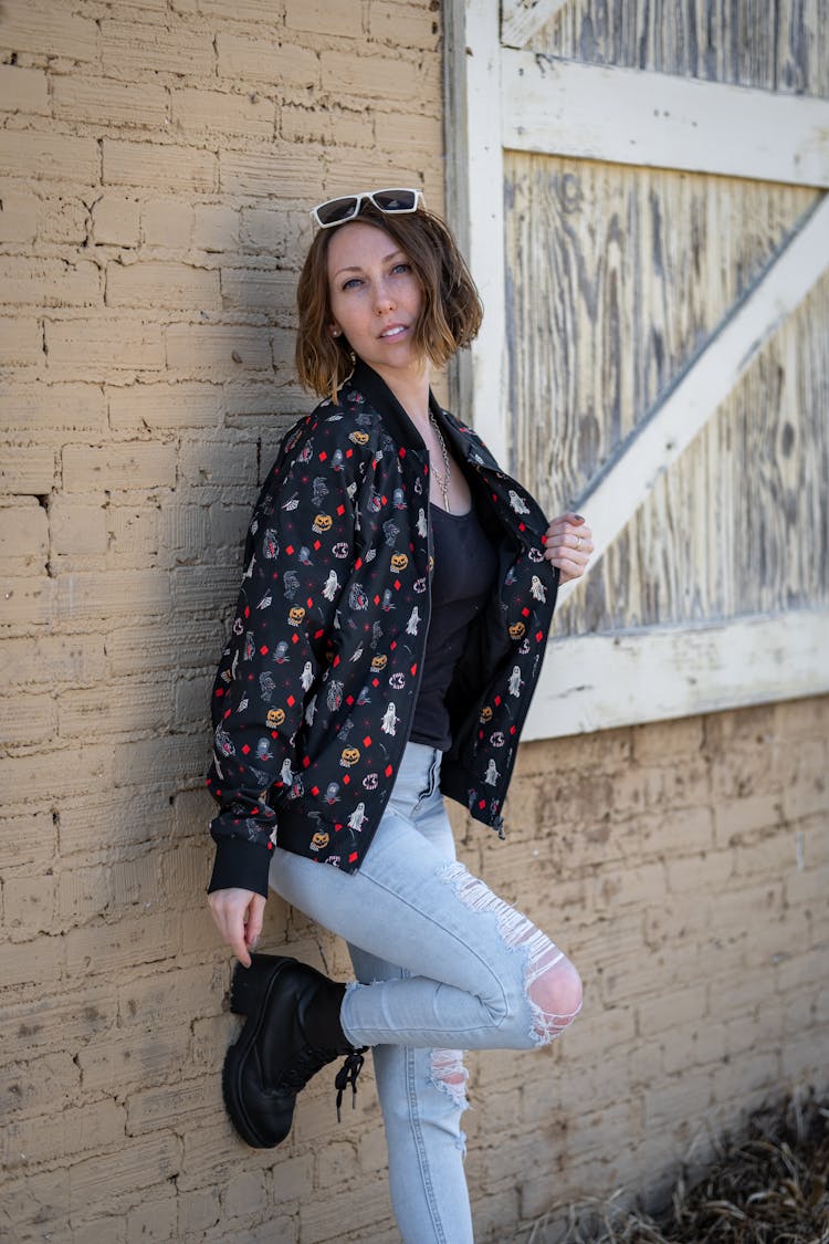 Woman In Casual Wear Posing Near House Wall