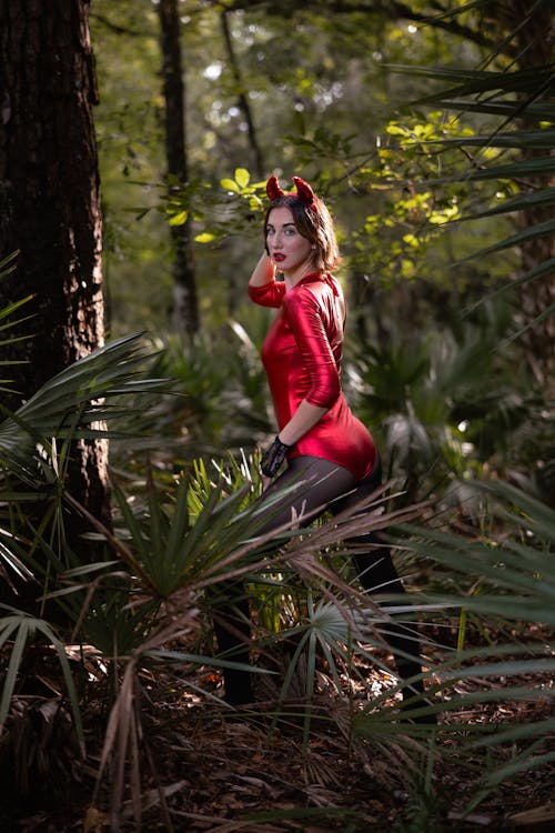 Woman in a Devil Costume Posing in the Forest 
