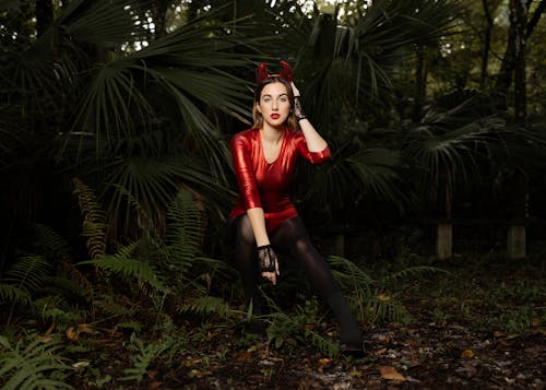 Woman in a Devil Costume Posing in the Forest 