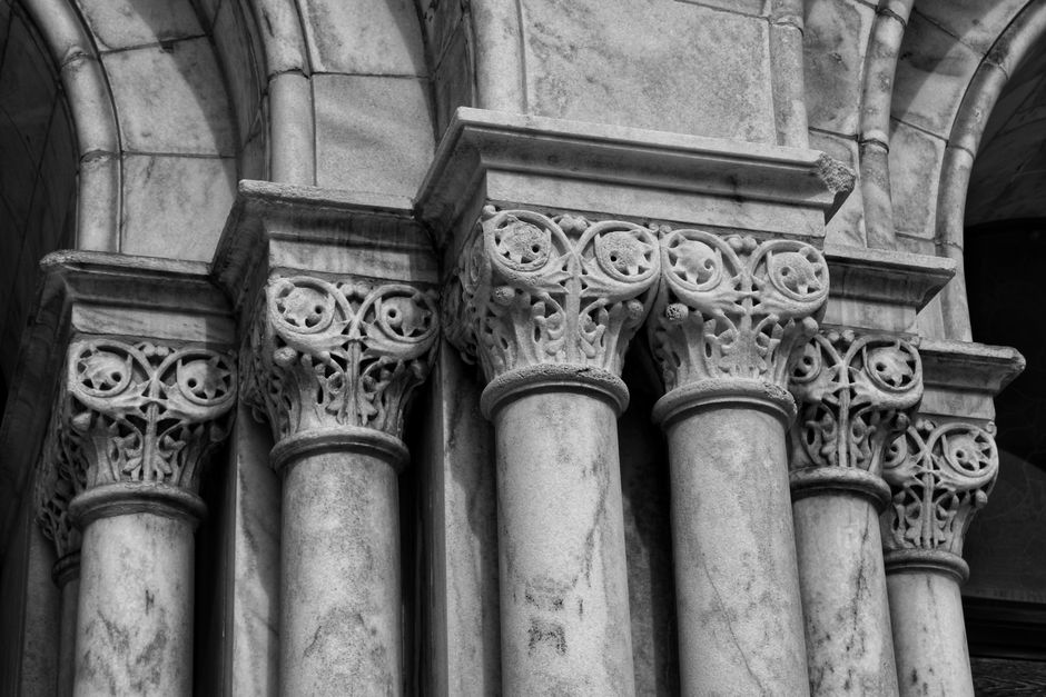 Intricately designed columns showcasing architectural elegance in grayscale tones.