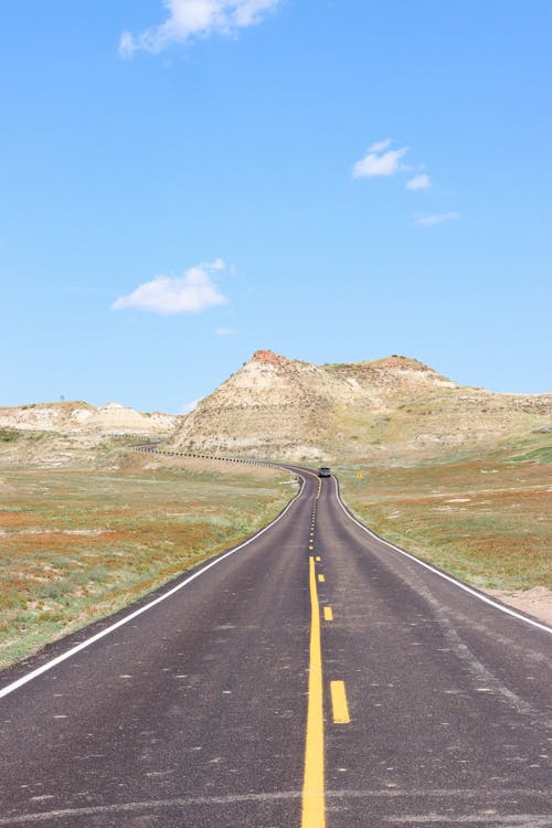 Free Landscape Photography of a Scenic Road in Theodore Roosevelt National Park Stock Photo