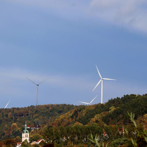 Photo of Wind Turbines on a Hill 
