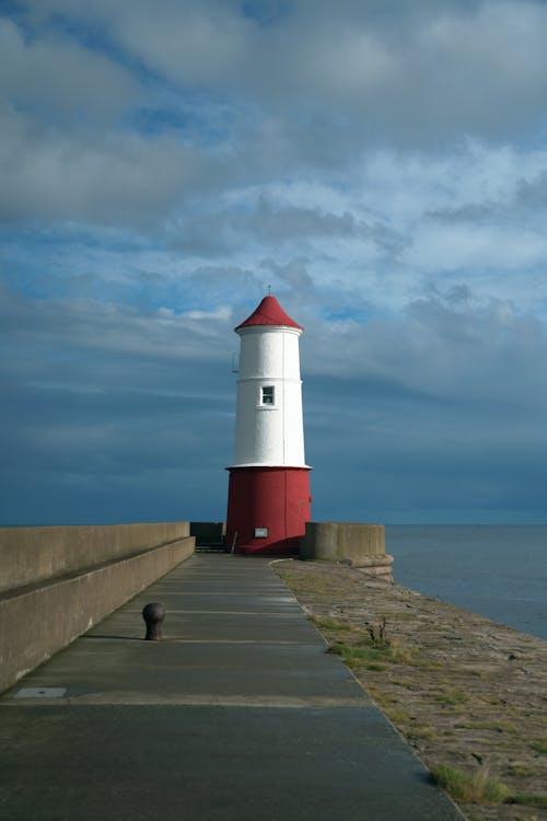 The Berwick Lighthouse under a Cloudy Sky