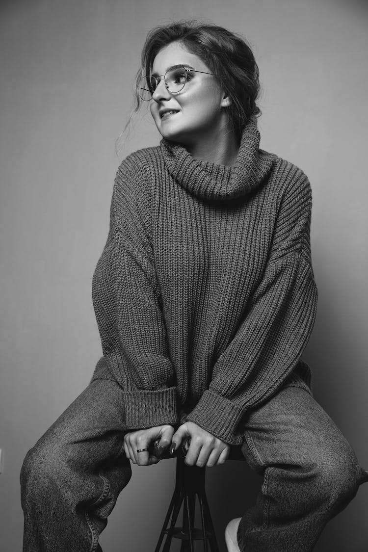 Woman Wearing A Sweater And Eyeglasses 