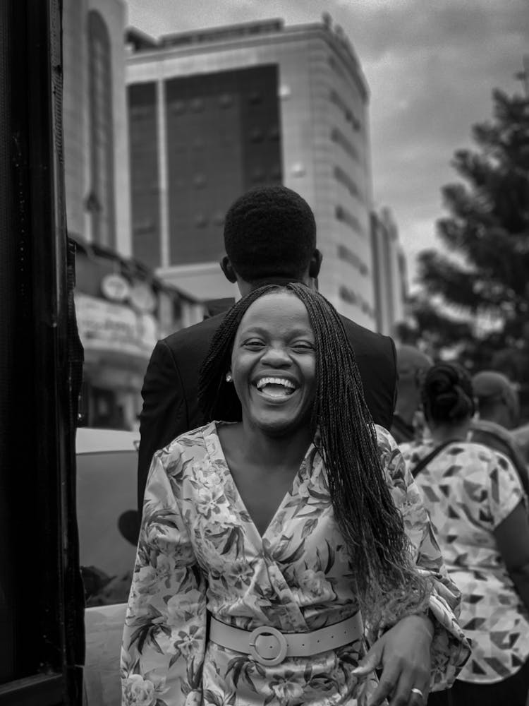 Grayscale Photo Of A Laughing Woman 