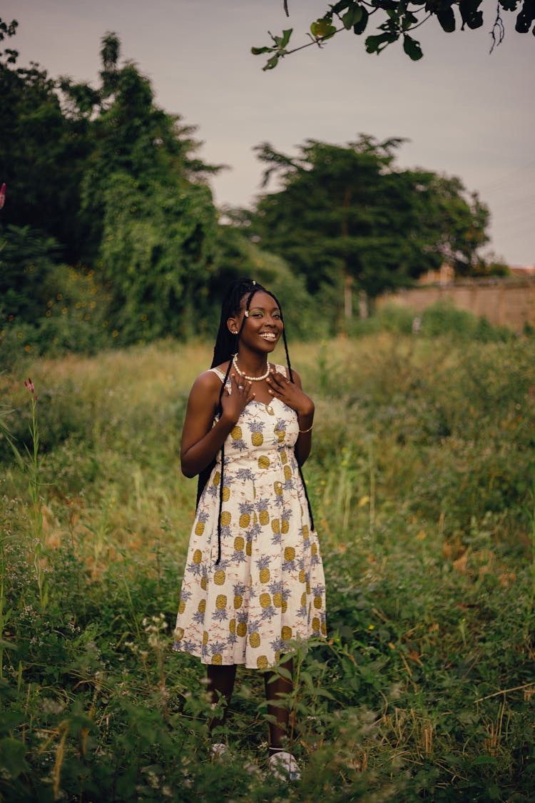 Woman In Dress Posing In Nature