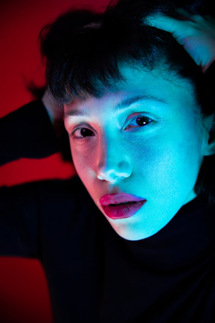 Close-up Of Woman Face In Blue Light