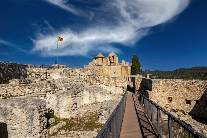 Medieval castle ruins under a dramatic sky
