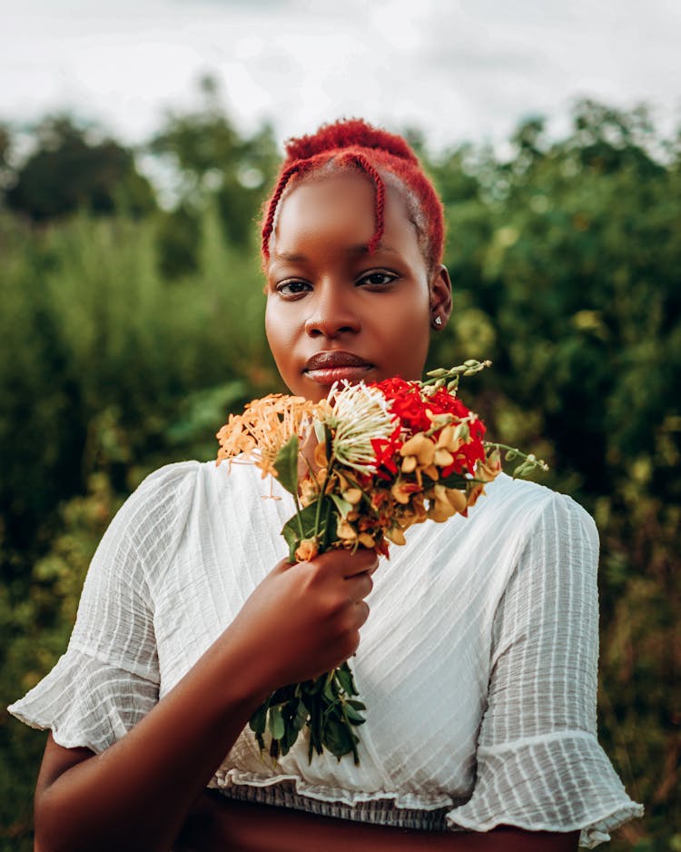 Rustic Portrait Of Woman Holding Bouquet